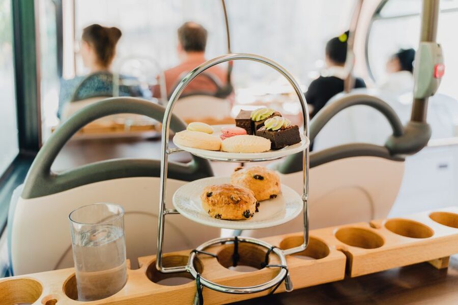 London: Afternoon Tea Bus with a Glass of Prosecco - Sandwiches, scones, and cakes on the move