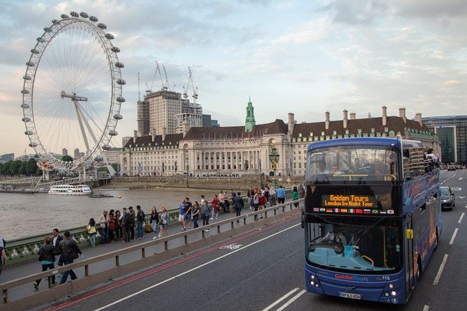 London by Night Sightseeing Open Top Bus Tour with Live Guide - Big Ben and Westminster Abbey under lights