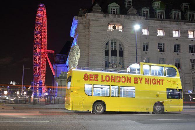 London by Night Sightseeing Tour - Open Top Bus - Tower Bridge glowing above the Thames