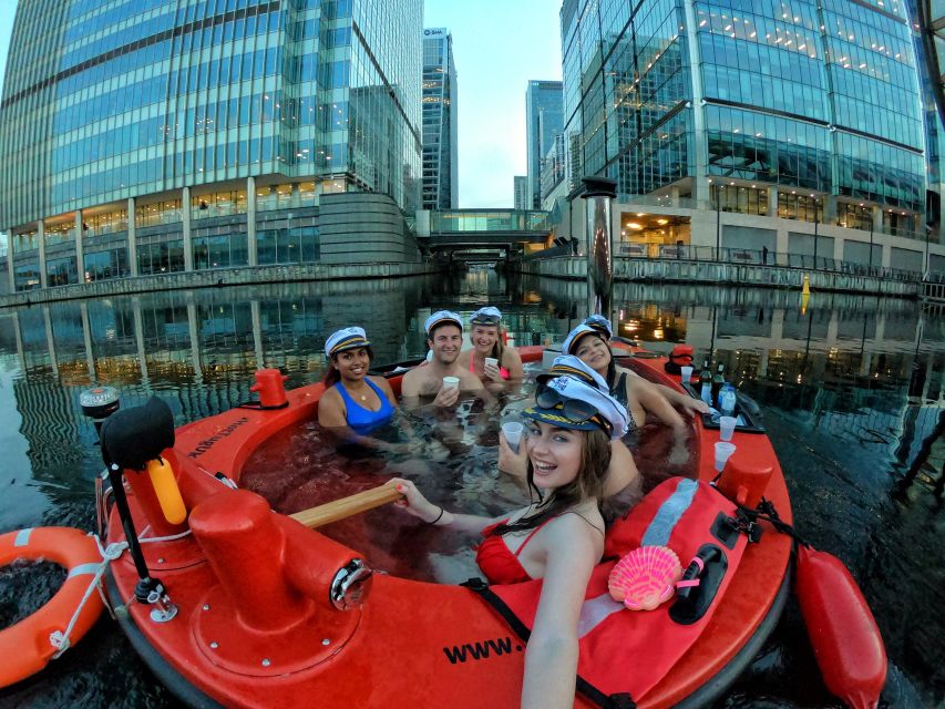 London: Hot Tub Boat Guided Historical Docklands Cruise - A hot tub with Canary Wharf as the backdrop