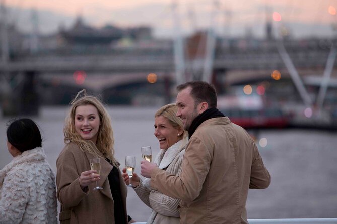 River Thames Evening Cruise with Sparkling wine and Canapés - HMS Belfast and Canary Wharf